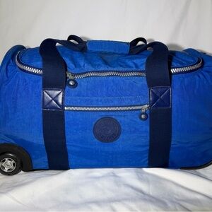 Kipling Royal Blue Rolling Duffel with Navy Straps
